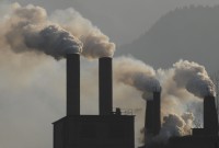 DOCU_GRUPO Smoke billows from a cement plant on the outskirts of Baokang